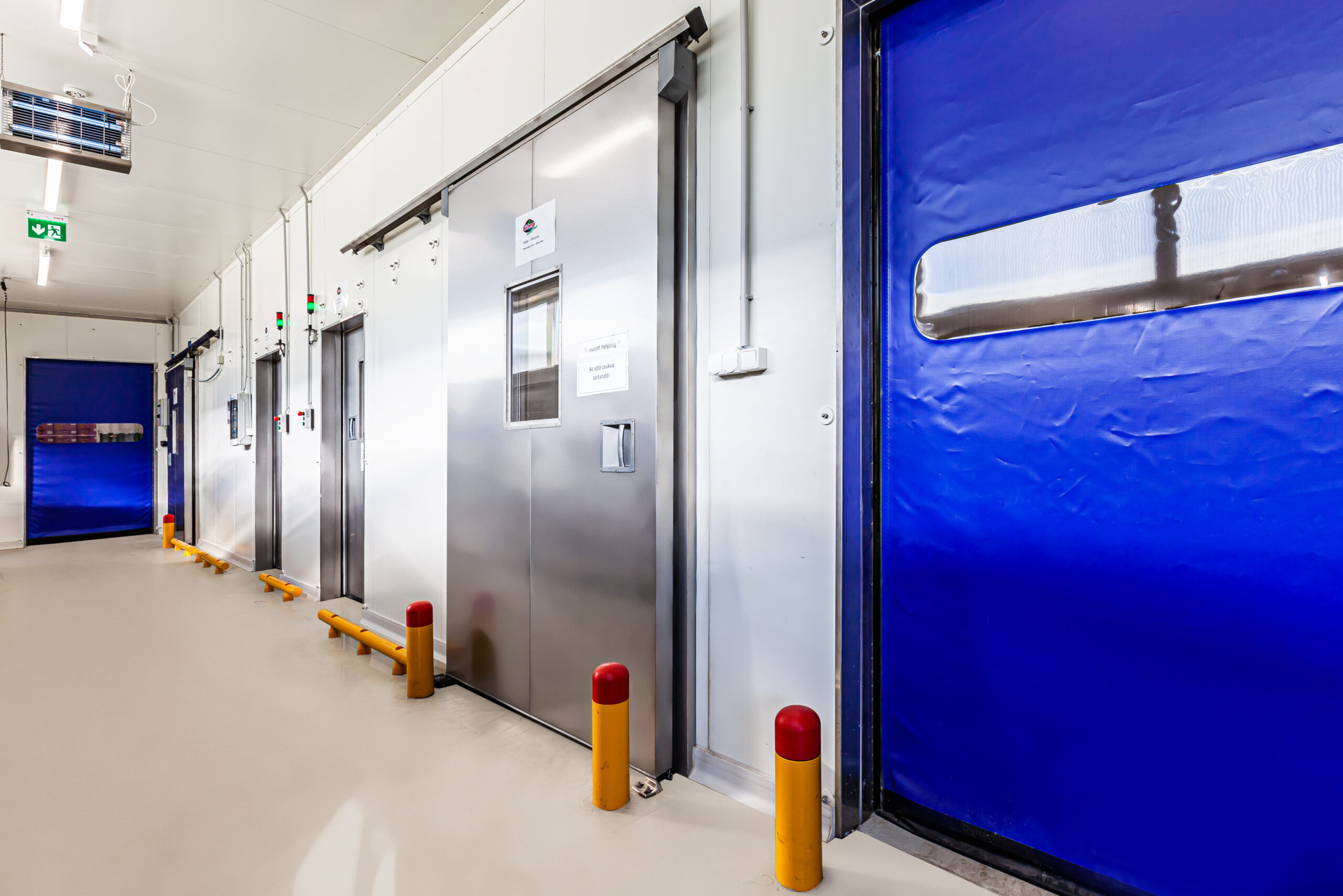 Food safety door design in a meat processing environment